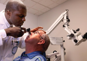 Dr. Gado with a patient.