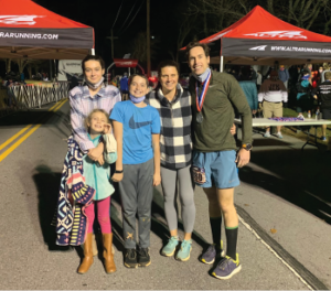 Jim Daniero, MD, celebrates with his family after completing the 2020 JFK 50 Mile race in 10 hours.